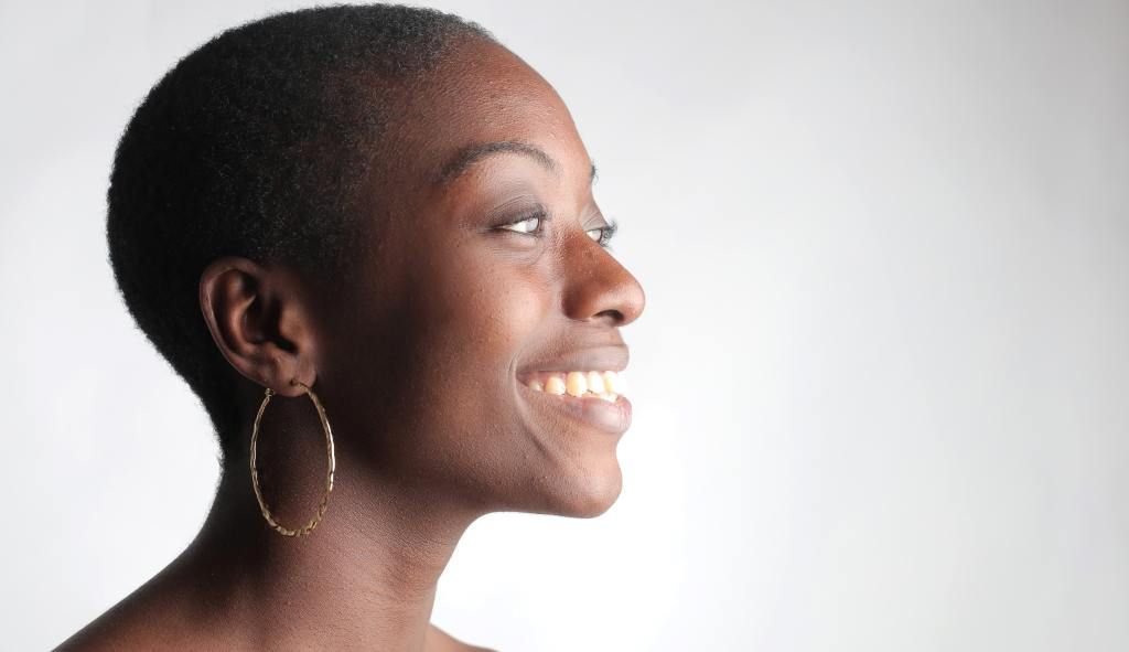 black woman smiling about having options for having children after cervical cancer