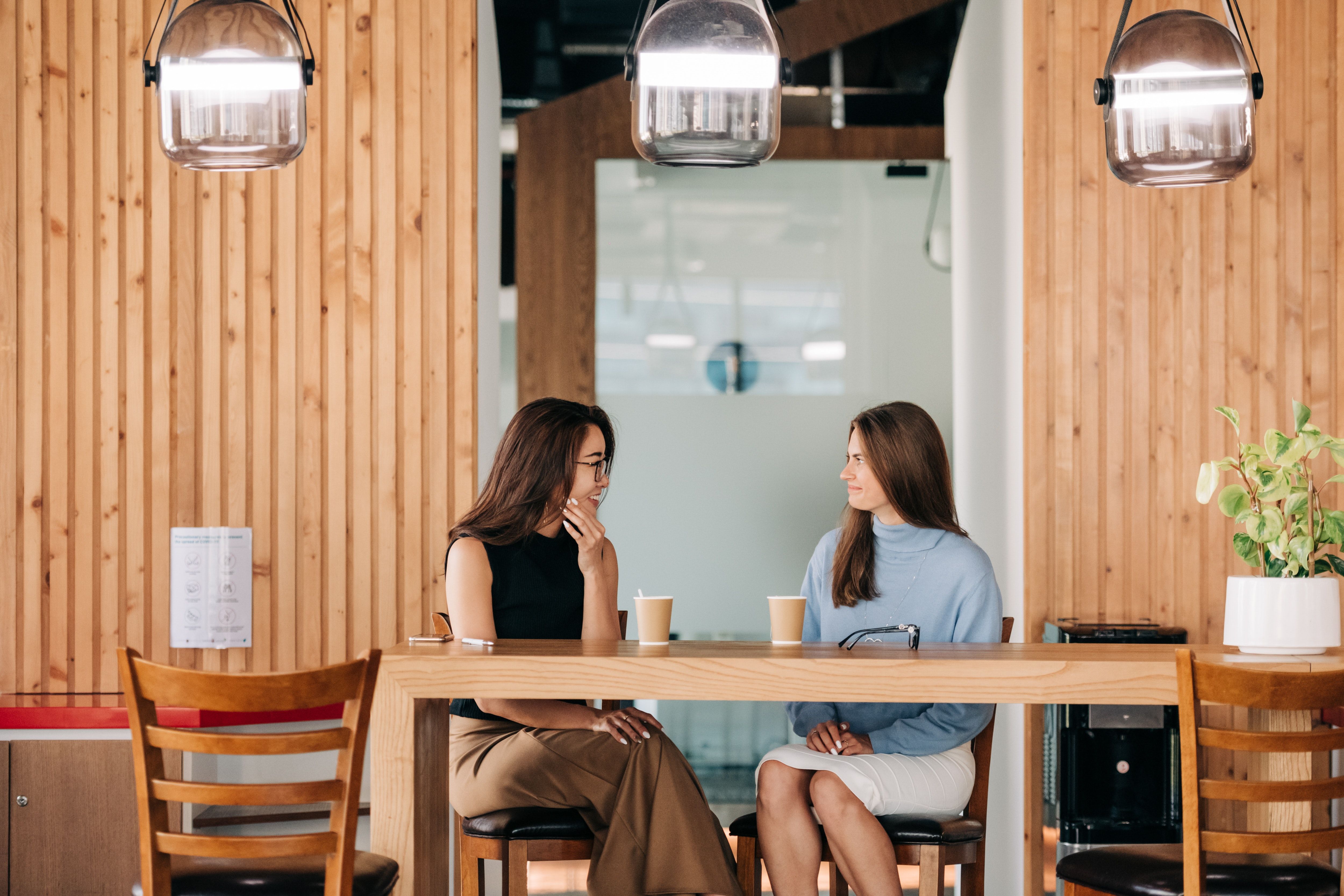 A surrogate and intended mother have a match meeting at a coffee shop
