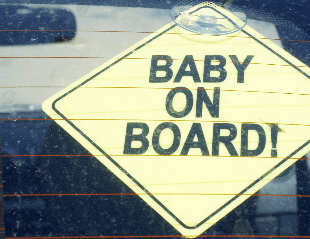Baby on board sticker after embryo transfer to surrogate