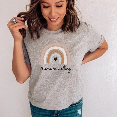 Woman wearing a grey Mama in Waiting surrogacy shirt