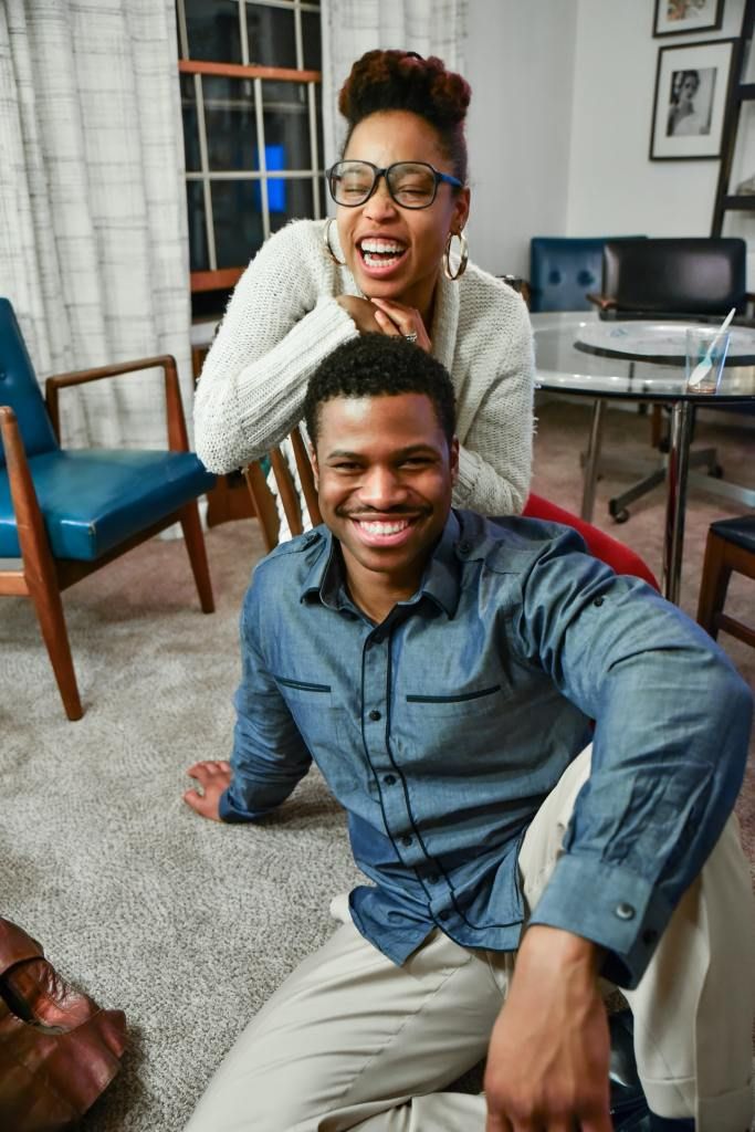 black couple in house smiling during a successful fertility journey