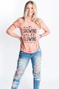 Woman in pink not showing still glowing shirt