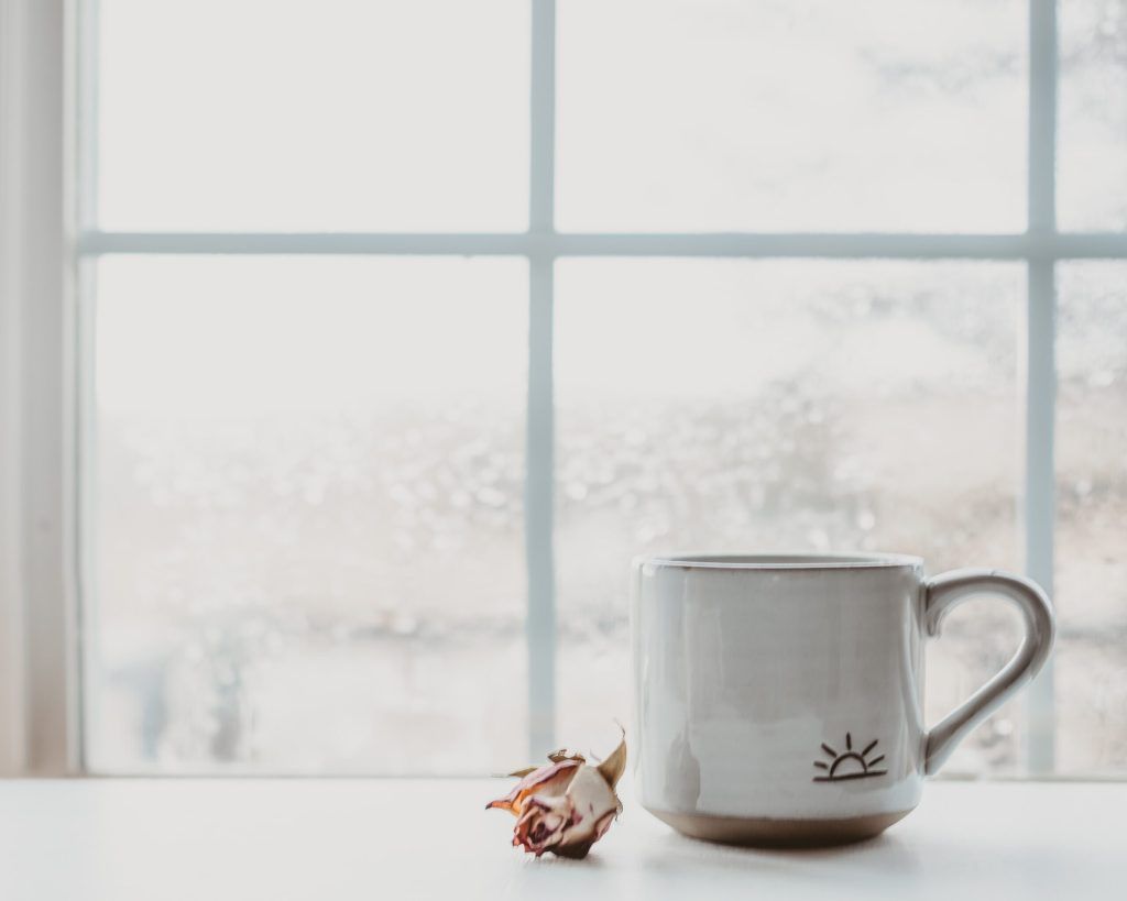 coffee mug on window sill